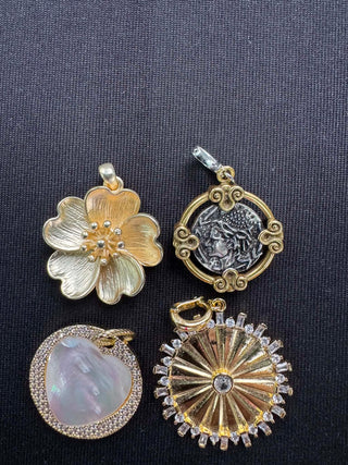 Assorted vintage-inspired charm pendants