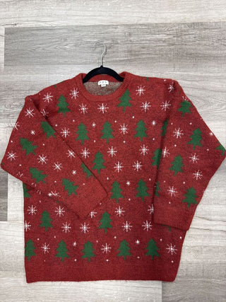 Red Christmas sweater with green tree and white snowflake pattern.