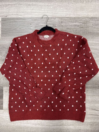 Red sweater with a dot pattern, shown in a one-size fit.