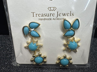 Handmade earrings set with turquoise stones in a gold-tone metal, featuring various shapes and a push back closure.