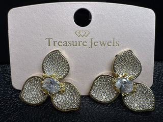 Gold three-petal floral earrings with crystal accents on a display card.