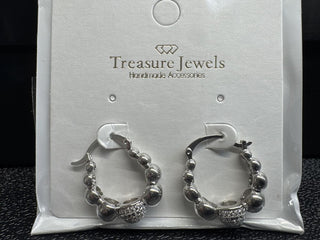 Silver hoop earrings with a beaded design and sparkling accents on a white card background.