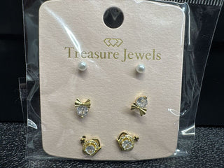 Set of gold-tone earrings with pearl and crystal accents, including bows and crowns.
