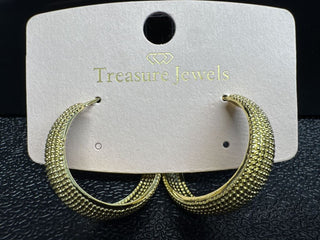 Textured gold hoop earrings with a post-back closure displayed on a branded card.